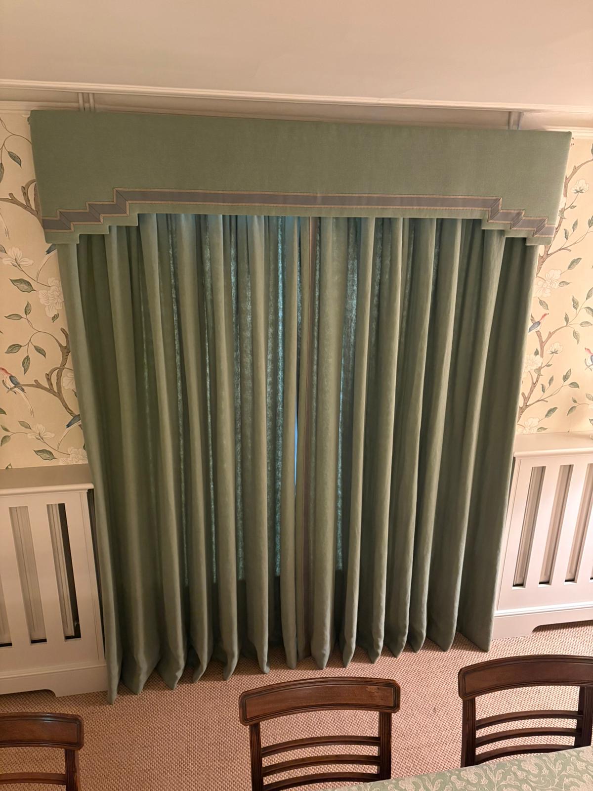 Sage green velvet curtains with stepped pelmet and braid trim