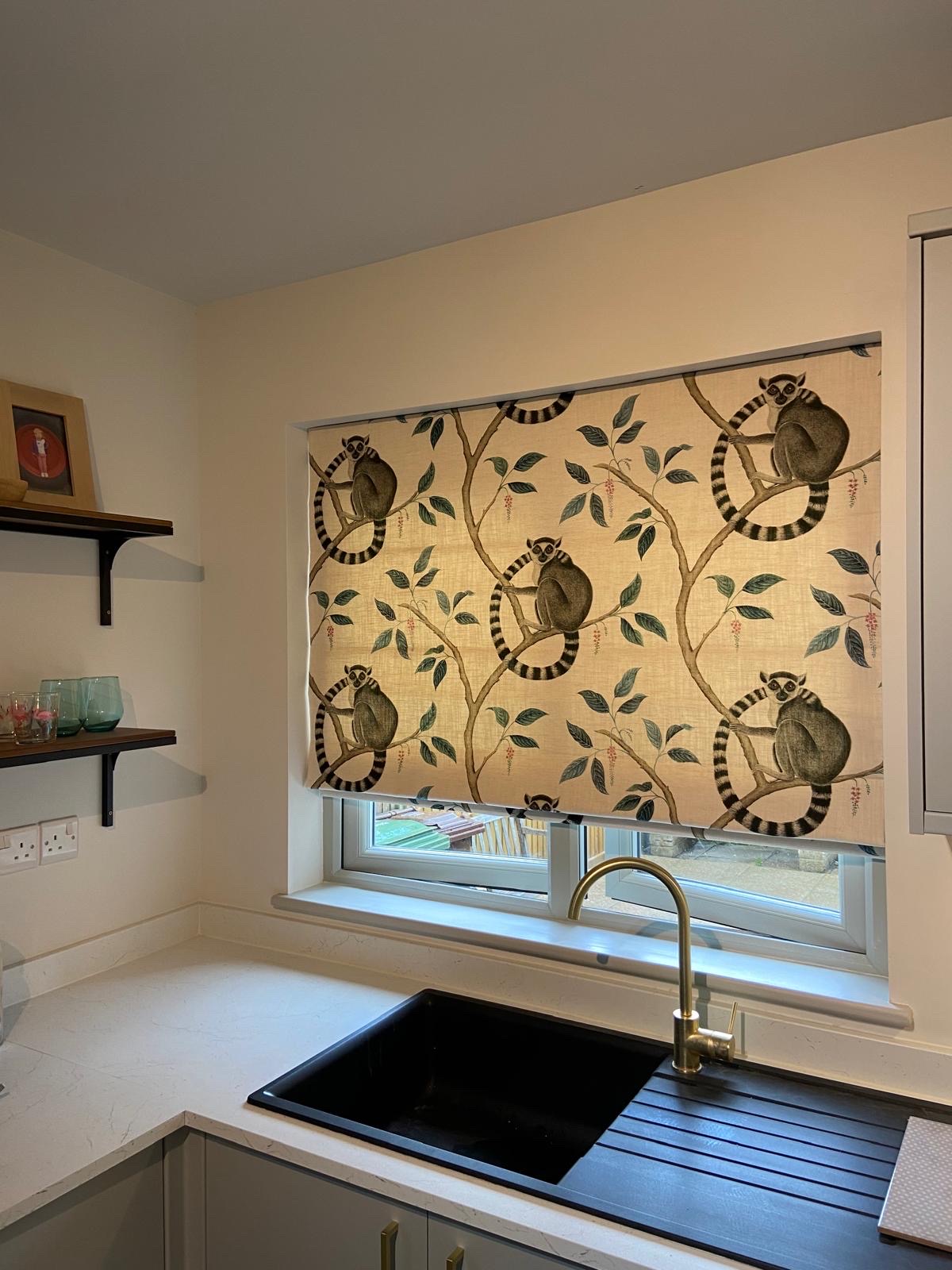 Lemur print Roman blind above a kitchen sink