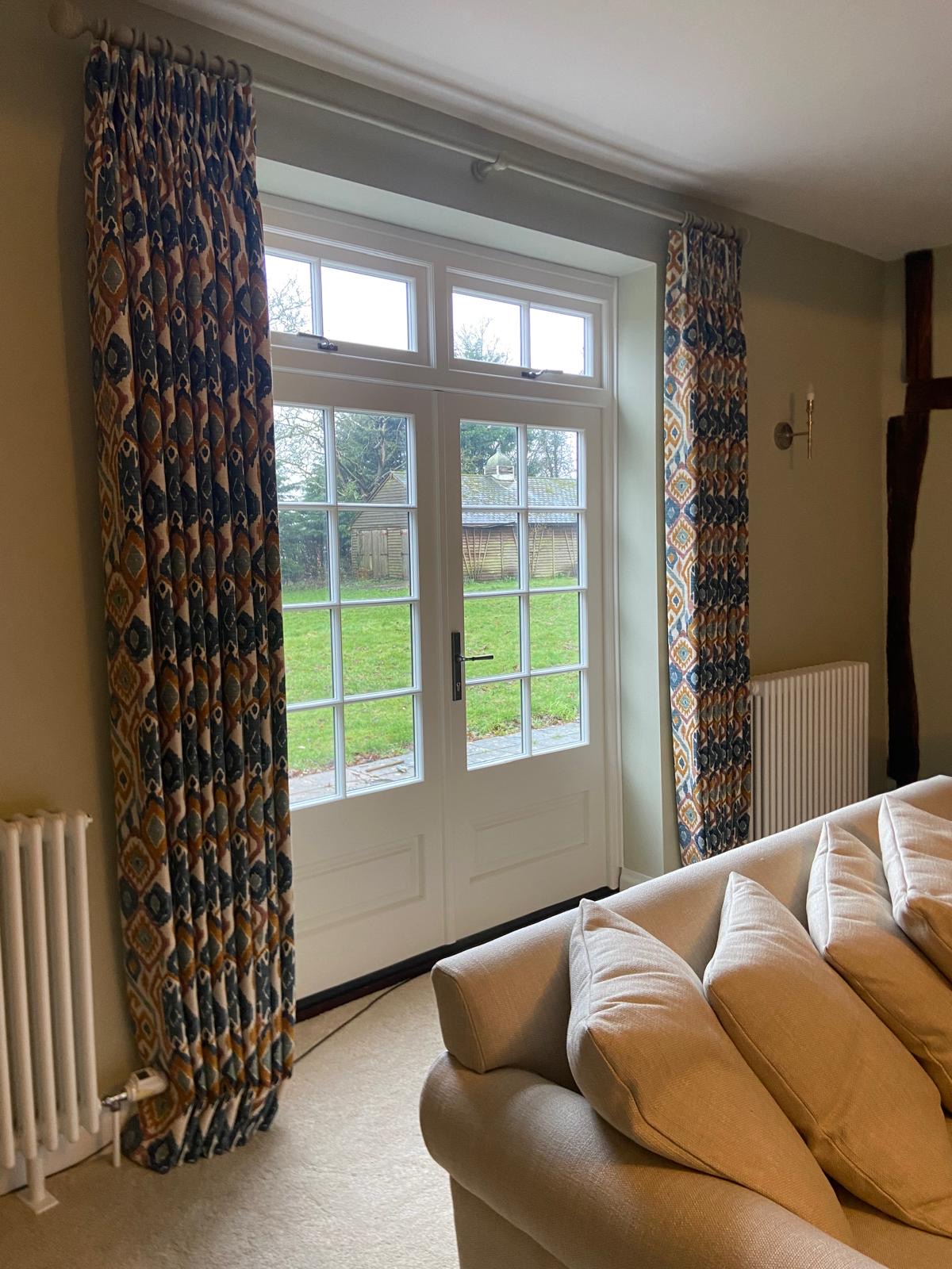Ikat pinch pleat curtains at French doors