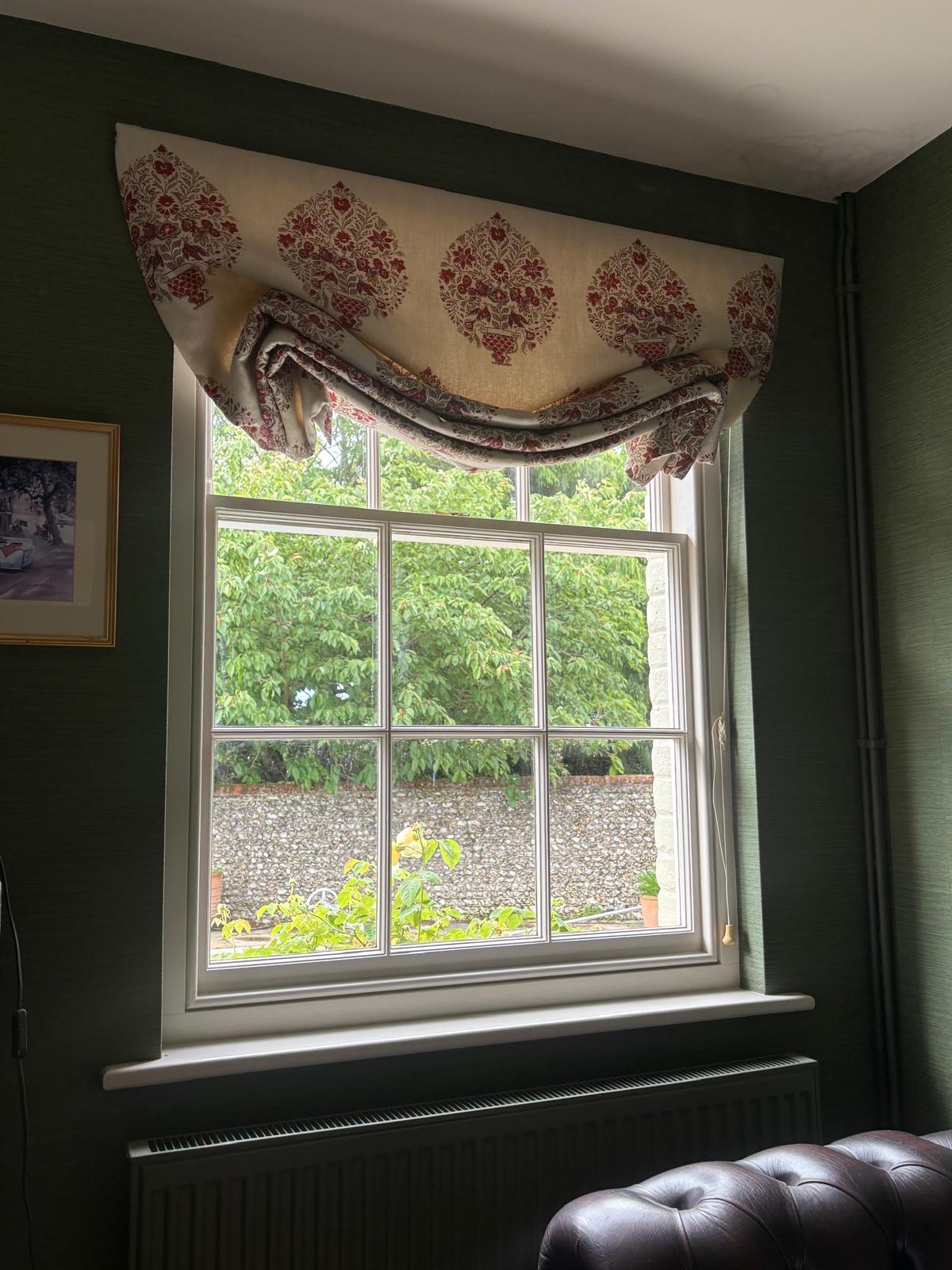 Reverse-roll Roman blind in deep green study