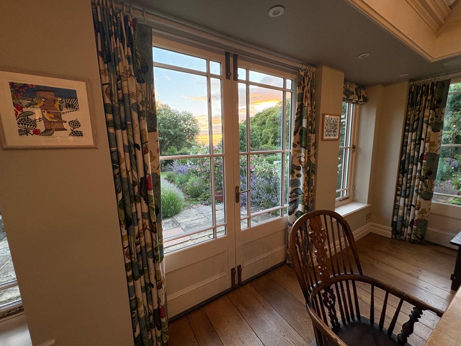 Botanical print curtains at garden French doors